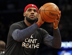 Cleveland Cavaliers forward LeBron James warms up before an NBA basketball game against the Brooklyn Nets at the Barclays Center, Monday, Dec. 8, 2014, in New York. Professional athletes have worn "I Can't Breathe" messages in protest of a grand jury ruling not to indict an officer in the death of a New York man. (AP Photo/Kathy Willens)